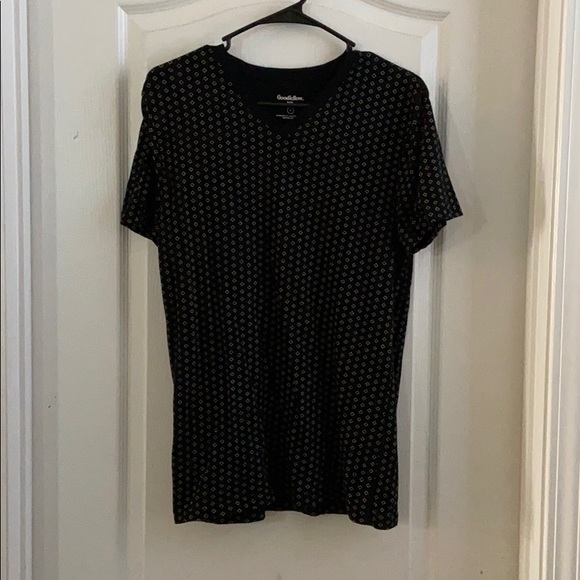Black T-shirt with patterns on it. - Picture 1 of 1